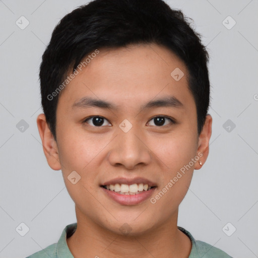 Joyful asian young-adult male with short  brown hair and brown eyes