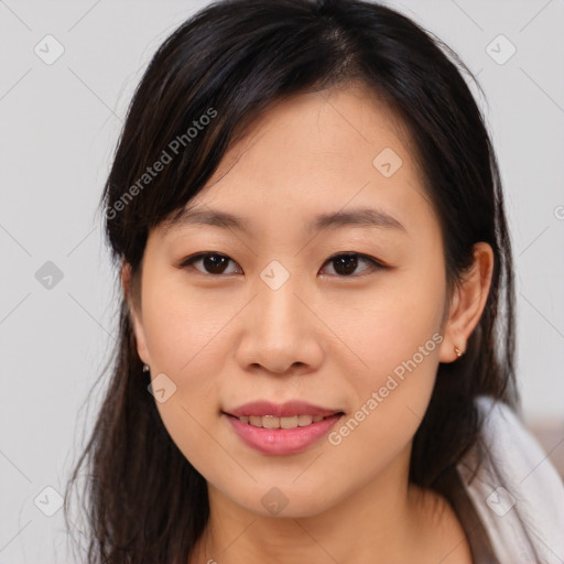 Joyful asian young-adult female with medium  brown hair and brown eyes