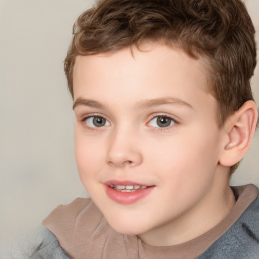 Joyful white child male with short  brown hair and brown eyes