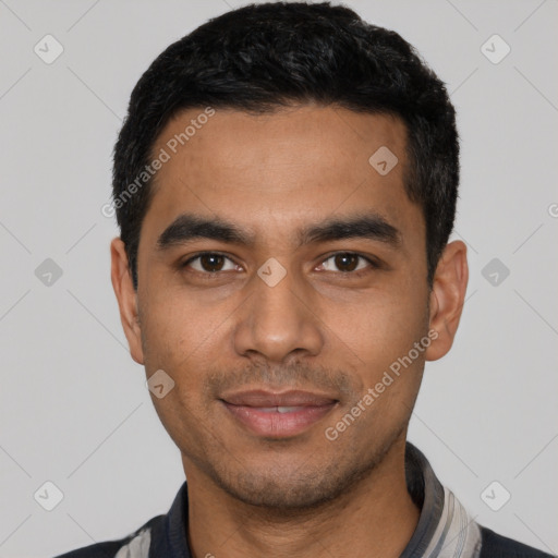 Joyful latino young-adult male with short  black hair and brown eyes