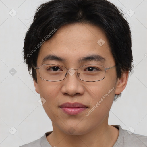 Joyful asian young-adult male with short  brown hair and brown eyes