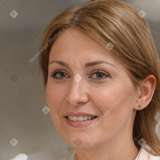 Joyful white adult female with long  brown hair and brown eyes