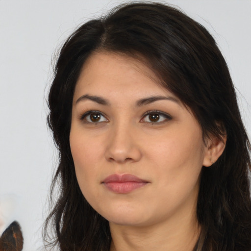 Neutral latino young-adult female with long  brown hair and brown eyes