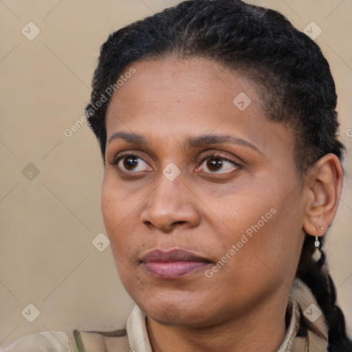 Joyful latino adult female with short  brown hair and brown eyes