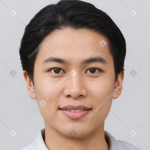 Joyful asian young-adult male with short  black hair and brown eyes