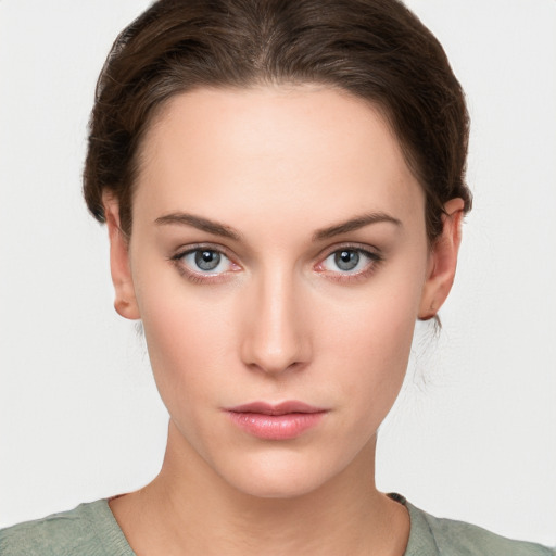 Neutral white young-adult female with short  brown hair and brown eyes