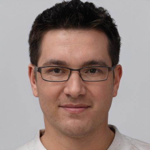 Joyful white adult male with short  brown hair and brown eyes