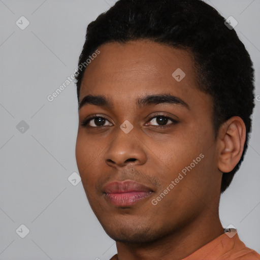 Neutral black young-adult male with short  black hair and brown eyes