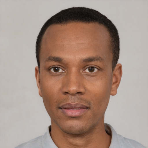 Neutral black young-adult male with short  black hair and brown eyes