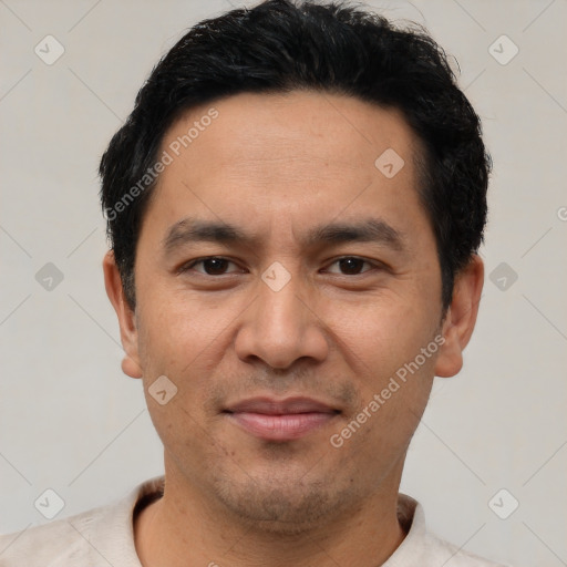 Joyful asian young-adult male with short  black hair and brown eyes