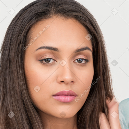 Neutral white young-adult female with long  brown hair and brown eyes