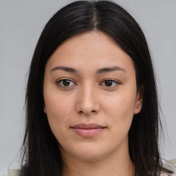 Joyful asian young-adult female with long  brown hair and brown eyes