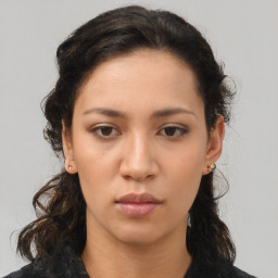 Neutral asian young-adult female with medium  brown hair and brown eyes