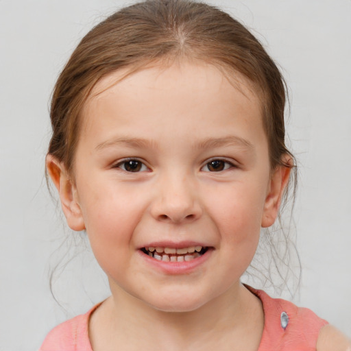 Joyful white child female with medium  brown hair and brown eyes