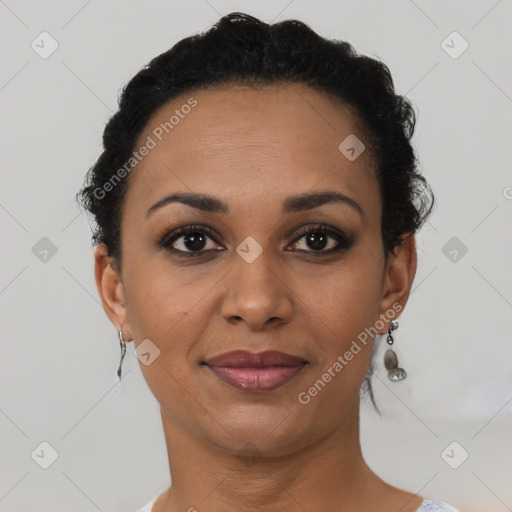 Joyful black young-adult female with short  brown hair and brown eyes