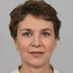 Joyful white adult female with short  brown hair and brown eyes