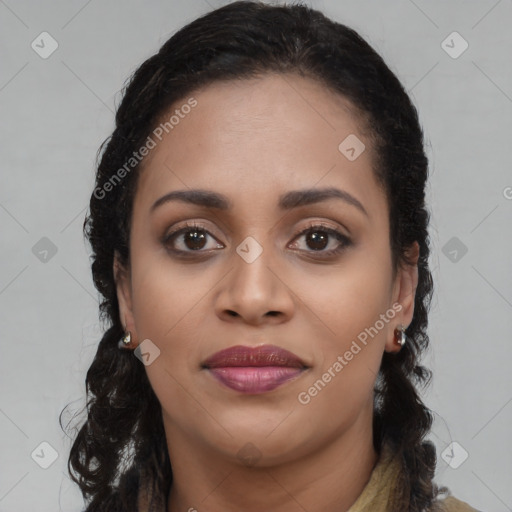 Joyful black young-adult female with long  brown hair and brown eyes