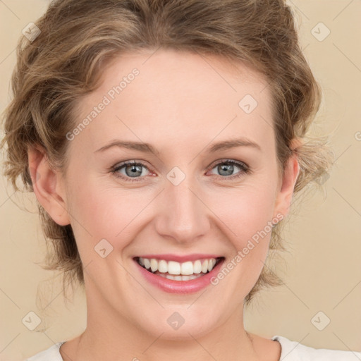 Joyful white young-adult female with medium  brown hair and green eyes