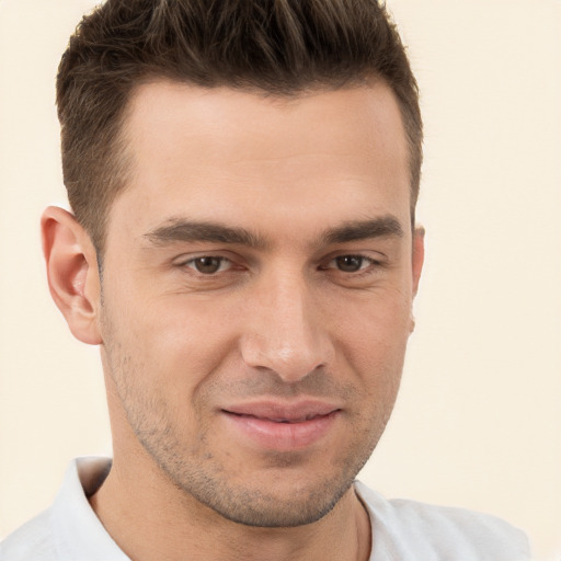 Joyful white young-adult male with short  brown hair and brown eyes