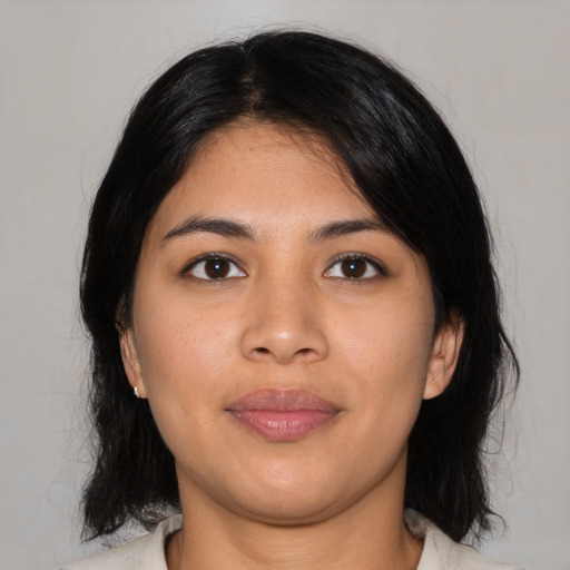 Joyful asian young-adult female with medium  black hair and brown eyes
