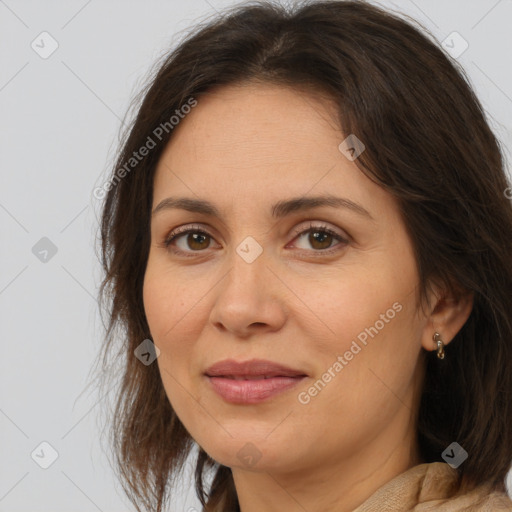 Joyful white adult female with medium  brown hair and brown eyes