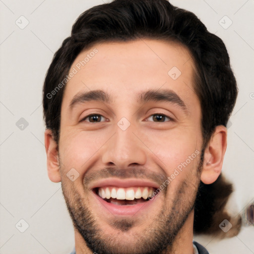 Joyful white young-adult male with short  black hair and brown eyes