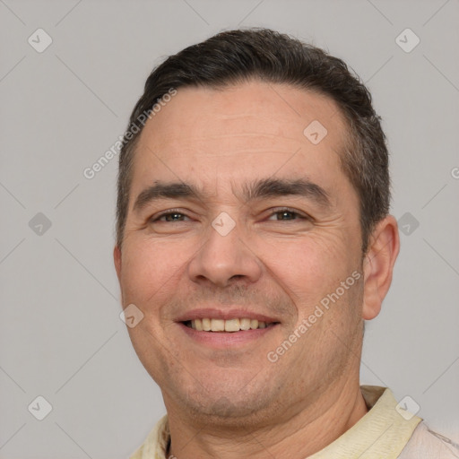 Joyful white adult male with short  brown hair and brown eyes