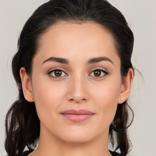 Joyful white young-adult female with long  brown hair and brown eyes