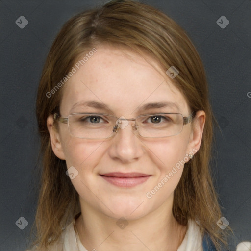 Joyful white young-adult female with long  brown hair and blue eyes