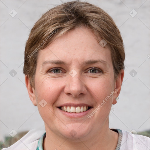 Joyful white young-adult female with short  brown hair and grey eyes