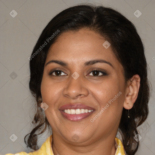 Joyful latino adult female with medium  brown hair and brown eyes