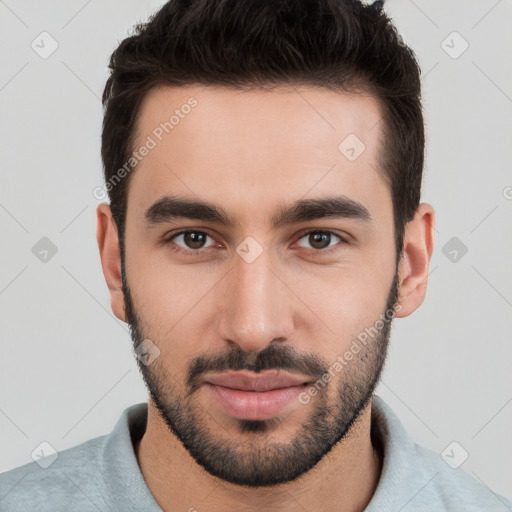 Joyful white young-adult male with short  black hair and brown eyes