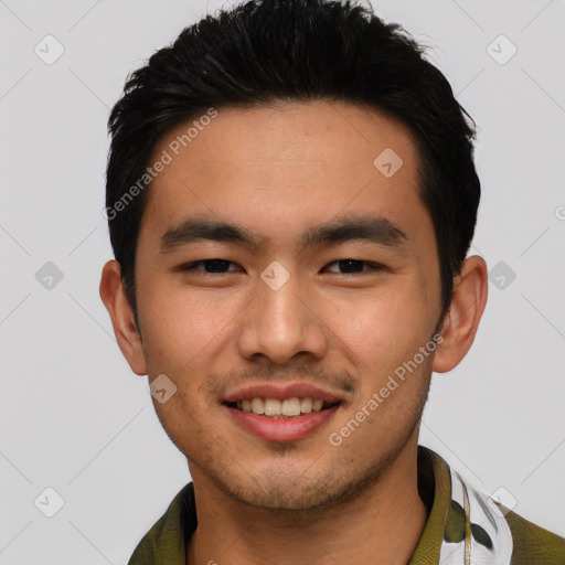 Joyful asian young-adult male with short  black hair and brown eyes