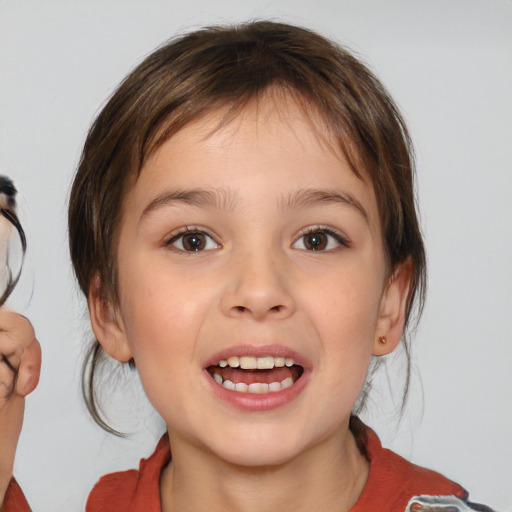 Joyful white child female with medium  brown hair and brown eyes