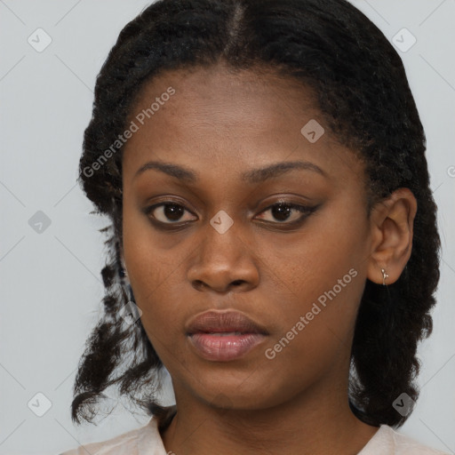 Neutral black young-adult female with medium  brown hair and brown eyes