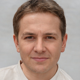 Joyful white adult male with short  brown hair and brown eyes