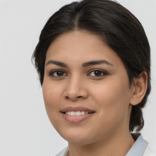 Joyful asian young-adult female with medium  brown hair and brown eyes