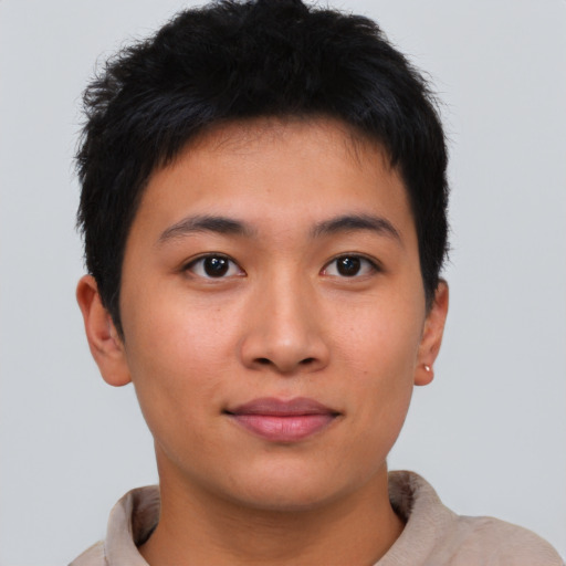 Joyful asian young-adult male with short  brown hair and brown eyes