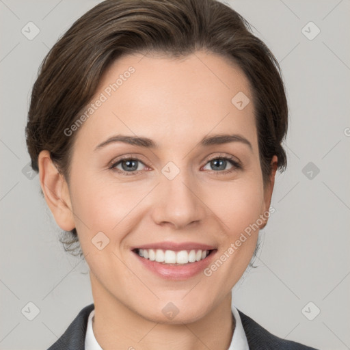 Joyful white young-adult female with short  brown hair and grey eyes