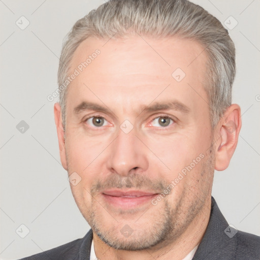 Joyful white adult male with short  brown hair and grey eyes