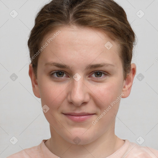 Joyful white young-adult female with short  brown hair and grey eyes