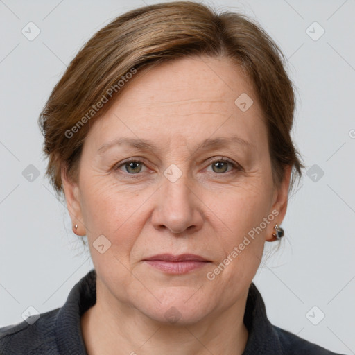 Joyful white adult female with medium  brown hair and grey eyes