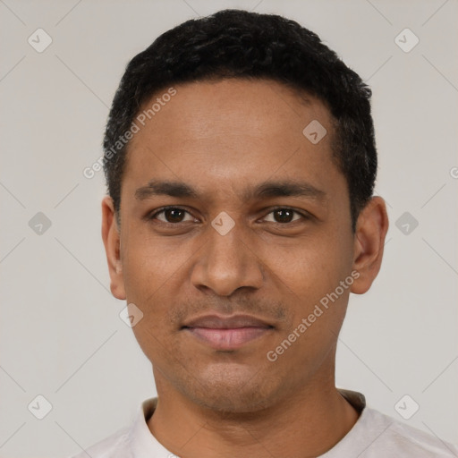 Joyful latino young-adult male with short  black hair and brown eyes