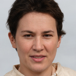 Joyful white adult female with short  brown hair and brown eyes