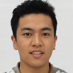 Joyful asian young-adult male with short  brown hair and brown eyes