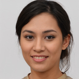 Joyful asian young-adult female with medium  brown hair and brown eyes