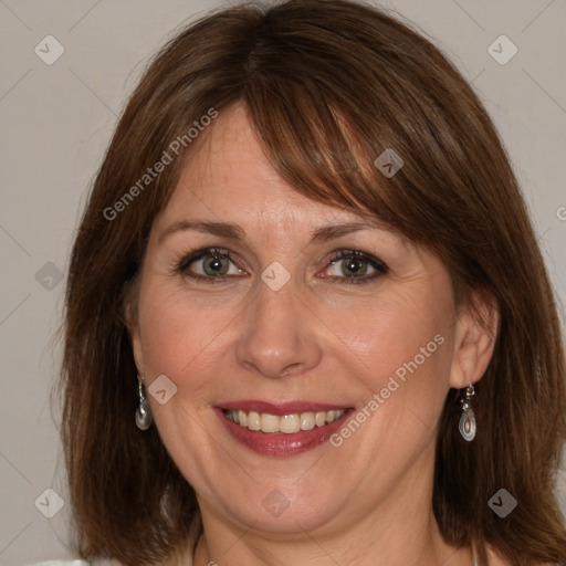 Joyful white adult female with medium  brown hair and grey eyes