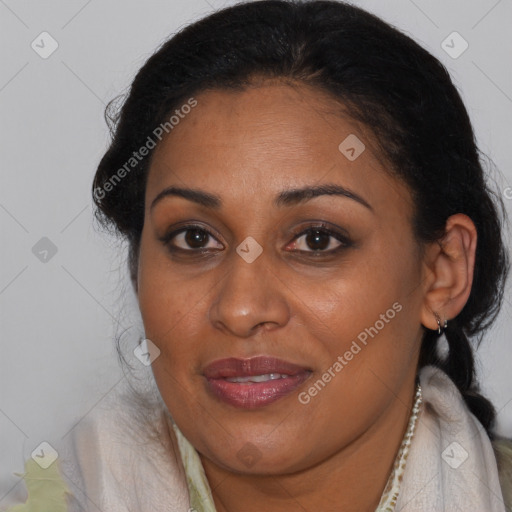 Joyful black adult female with long  brown hair and brown eyes