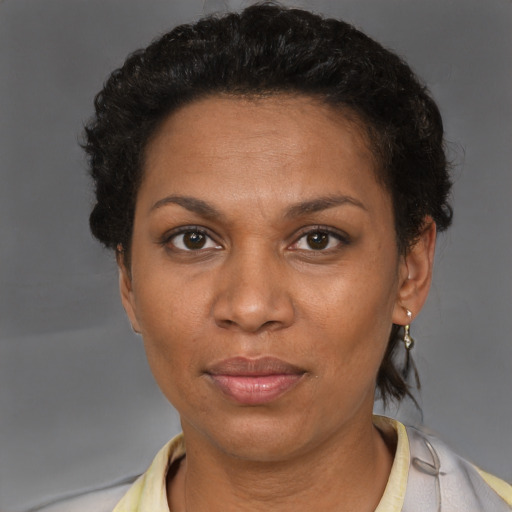 Neutral black adult female with short  brown hair and brown eyes