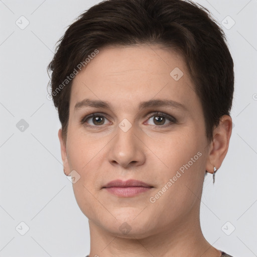 Joyful white young-adult female with short  brown hair and brown eyes